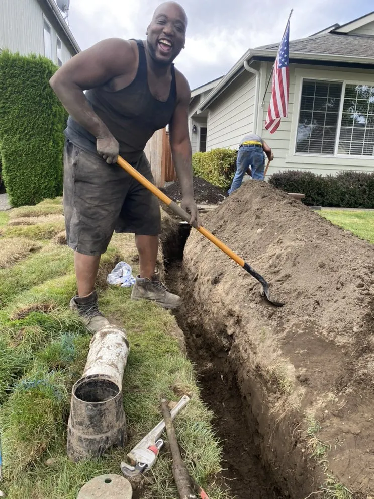 Southern Boyz team member working on a plumbing job at a Tacoma home